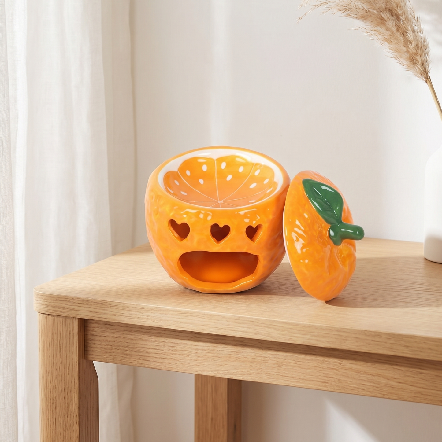 Quemador de aromas de ceramica con forma de naranja y calados de corazon